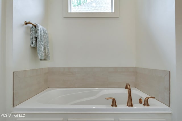 bathroom featuring a tub to relax in