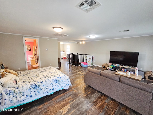 906 W Lakeshore Dr, Carriere, MS 39426 - bedroom featuring crown molding, wood finished floors, and baseboards