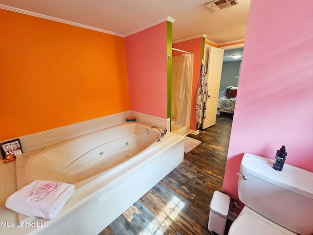 906 W Lakeshore Dr, Carriere, MS 39426 - bathroom featuring a shower stall, wood finished floors, a jetted tub, toilet, and ornamental molding