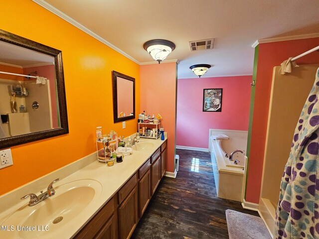 906 W Lakeshore Dr, Carriere, MS 39426 - full bath with crown molding, wood finished floors, a garden tub, a shower with shower curtain, and double vanity