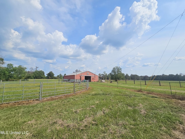 906 W Lakeshore Dr, Carriere, MS 39426 - view of yard featuring a rural view, an outbuilding, and an outdoor structure