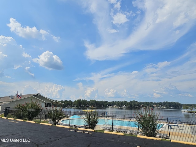 906 W Lakeshore Dr, Carriere, MS 39426 - community pool with fence and a water view
