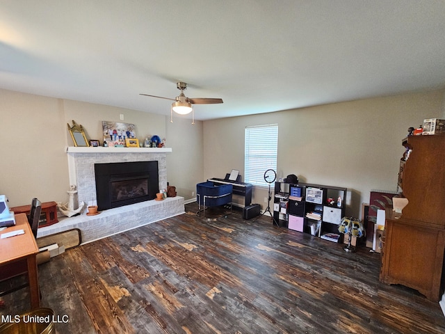 906 W Lakeshore Dr, Carriere, MS 39426 - home office featuring wood finished floors, a fireplace, and ceiling fan
