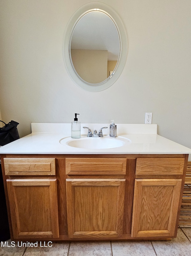 906 W Lakeshore Dr, Carriere, MS 39426 - bathroom featuring vanity and tile patterned flooring