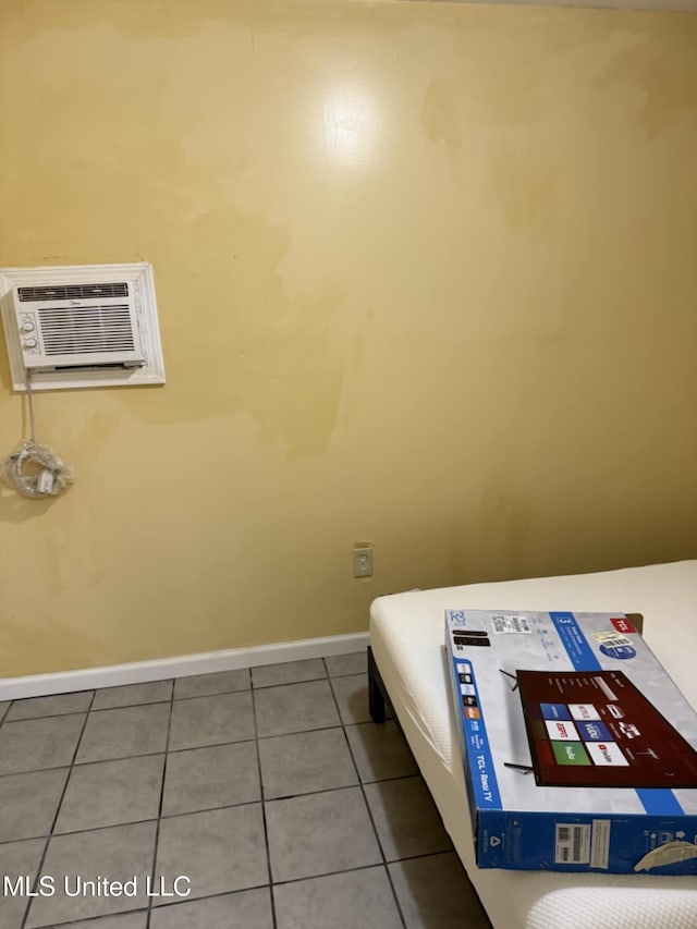 324 Crawford St, Biloxi, MS 39530 - tiled bedroom with a wall mounted AC and baseboards