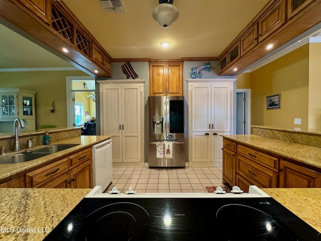 kitchen featuring light tile patterned flooring, crown molding, stainless steel appliances, and sink