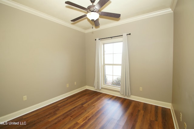 unfurnished room featuring dark wood-type flooring, crown molding, and baseboards