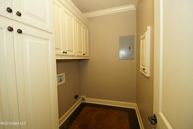 laundry area featuring washer hookup, electric panel, cabinet space, crown molding, and baseboards