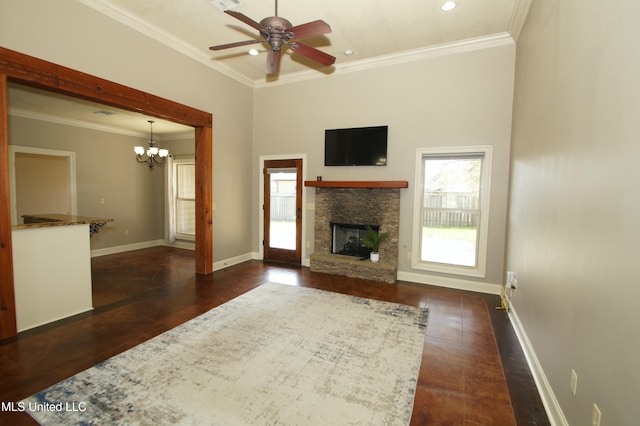 unfurnished living room featuring crown molding, baseboards, ceiling fan with notable chandelier, a fireplace, and wood finished floors