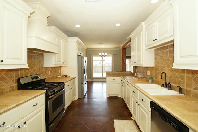 kitchen with premium range hood, a sink, light countertops, appliances with stainless steel finishes, and a chandelier