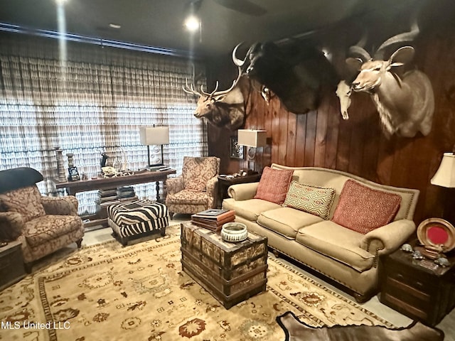 living room with wood walls