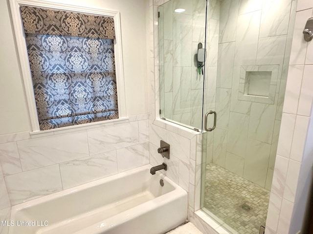 bathroom featuring separate shower and tub