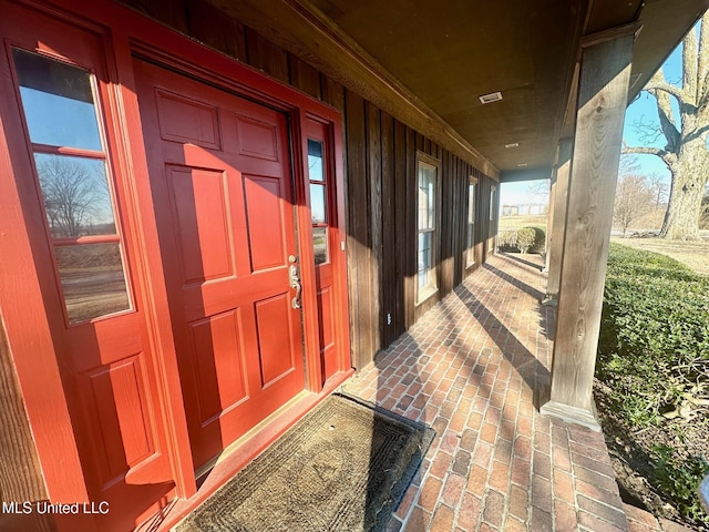 doorway to property featuring a porch