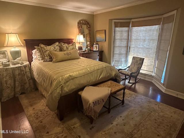 bedroom featuring crown molding and wood-type flooring