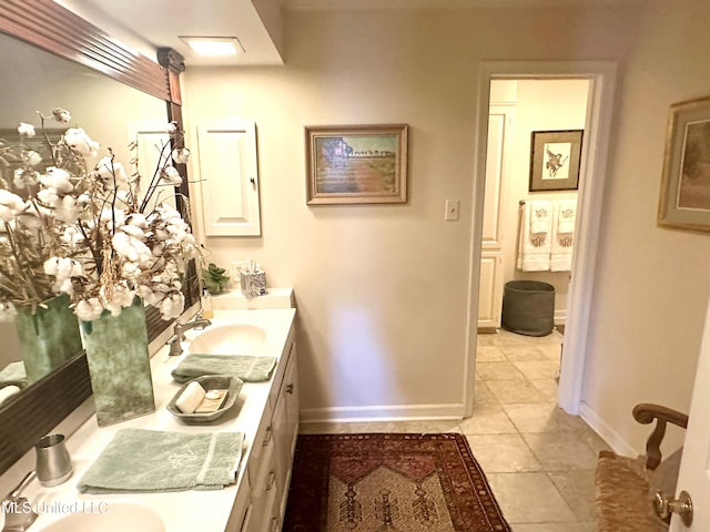 bathroom with tile patterned flooring and vanity