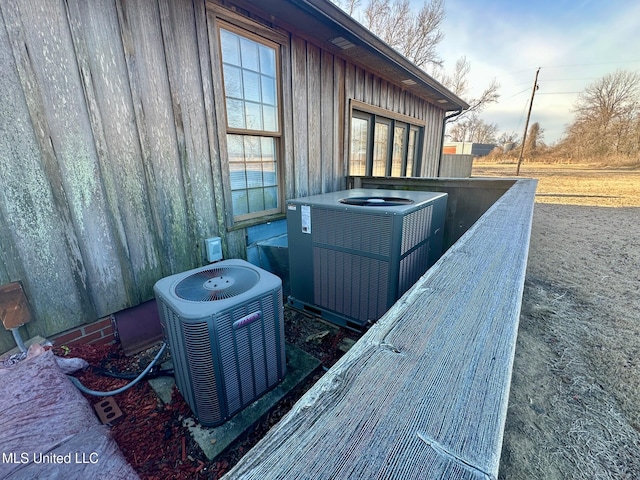 exterior space with central AC unit and a balcony