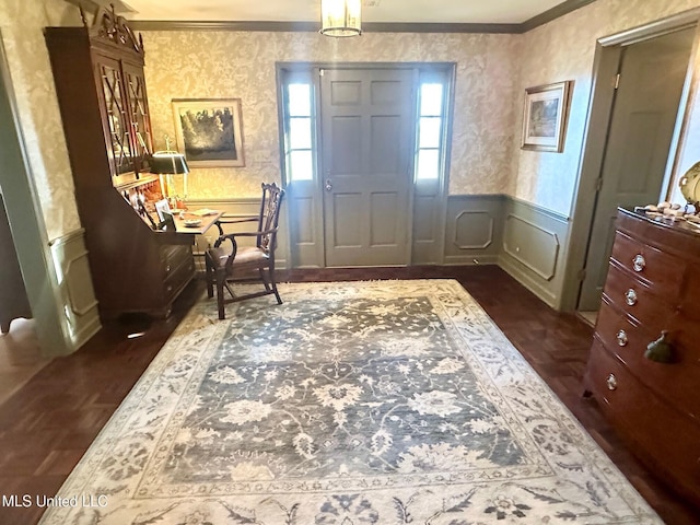 entrance foyer featuring crown molding and dark parquet floors