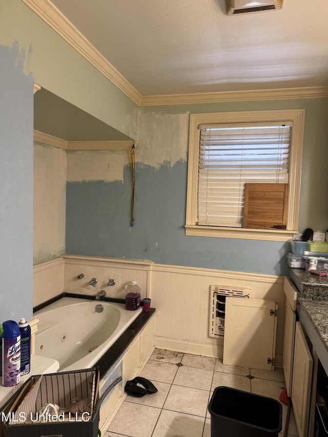 full bath with tile patterned flooring, wainscoting, heating unit, a whirlpool tub, and crown molding