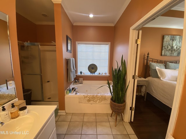 bathroom featuring crown molding, a tub with jets, a stall shower, and tile patterned floors