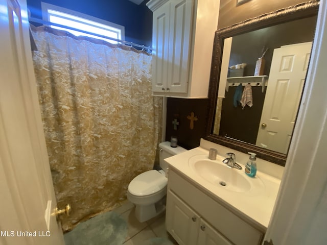 full bathroom with tile patterned floors, curtained shower, toilet, and vanity