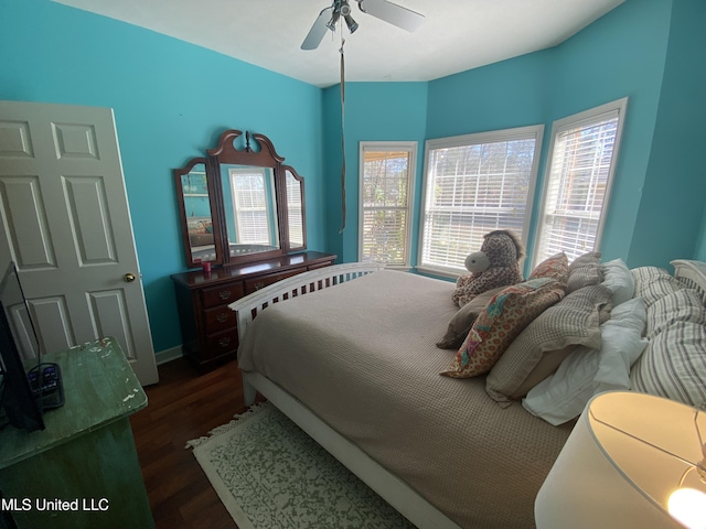 bedroom featuring dark wood-style floors and a ceiling fan