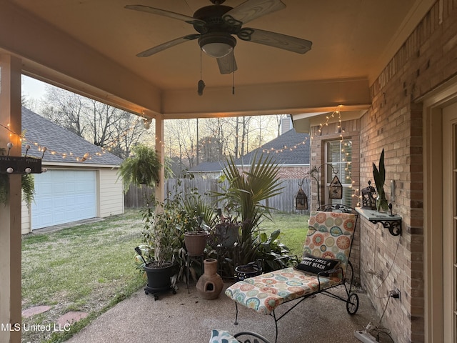 view of patio / terrace with ceiling fan and fence