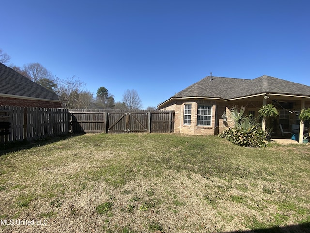 view of yard featuring a fenced backyard