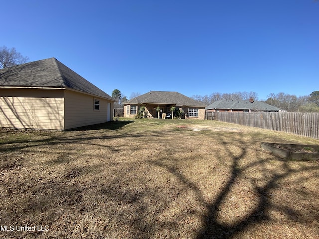 view of yard featuring a garden and fence