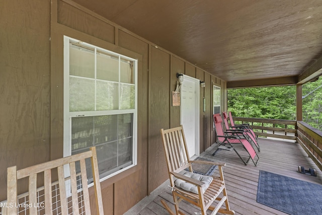wooden deck featuring covered porch