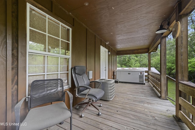 wooden deck with central air condition unit