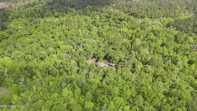 aerial view featuring a view of trees