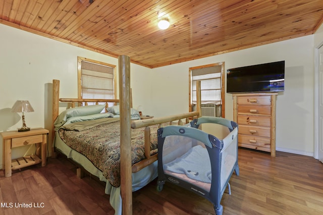 bedroom with cooling unit, wood finished floors, and wooden ceiling
