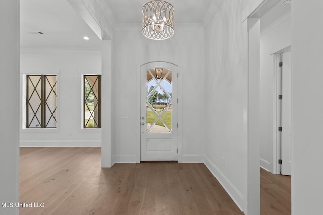 308 Lois Ct, Madison, MS 39110 - entrance foyer featuring a chandelier, wood finished floors, crown molding, and baseboards