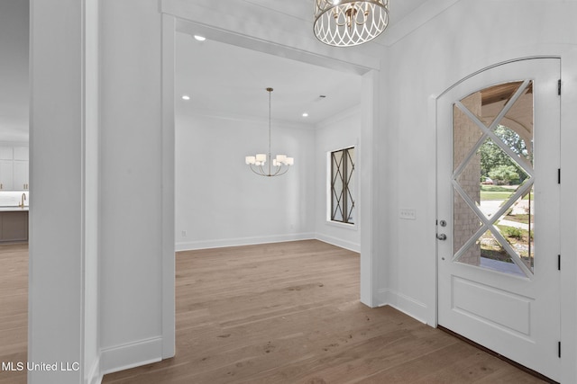 308 Lois Ct, Madison, MS 39110 - foyer entrance with a chandelier, wood finished floors, and baseboards