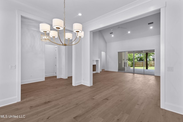 308 Lois Ct, Madison, MS 39110 - unfurnished dining area with a chandelier, wood finished floors, recessed lighting, baseboards, and high vaulted ceiling