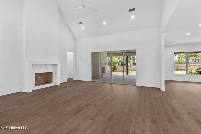 308 Lois Ct, Madison, MS 39110 - unfurnished living room featuring ceiling fan, high vaulted ceiling, plenty of natural light, a premium fireplace, and baseboards