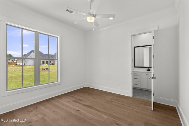 308 Lois Ct, Madison, MS 39110 - unfurnished bedroom with wood finished floors, ornamental molding, baseboards, ensuite bathroom, and a sink