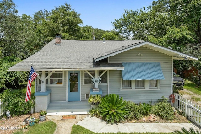 828 Woodward Ave, Gulfport, MS 39501 - view of front of property with roof with shingles and a chimney