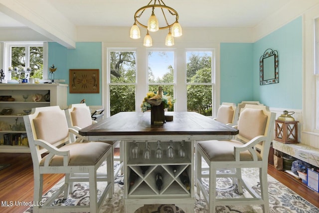 828 Woodward Ave, Gulfport, MS 39501 - dining space with wood finished floors and a chandelier