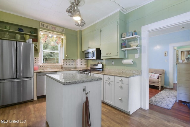 828 Woodward Ave, Gulfport, MS 39501 - kitchen featuring stainless steel appliances, open shelves, ornamental molding, dark wood-type flooring, and decorative backsplash