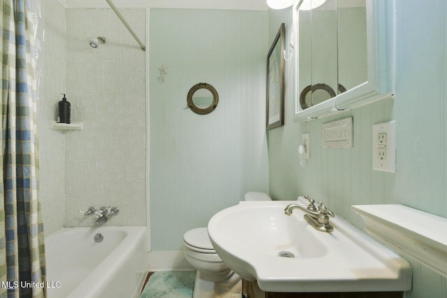 full bathroom with toilet, sink, and shower / tub combo with curtain