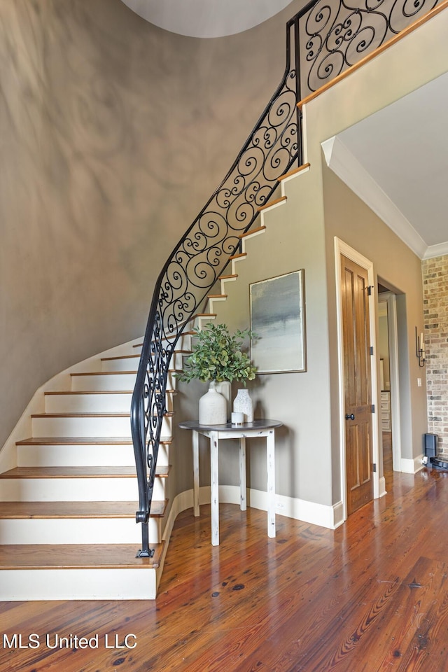 430 Johnstone Dr, Madison, MS 39110 - stairs featuring crown molding, wood finished floors, and baseboards
