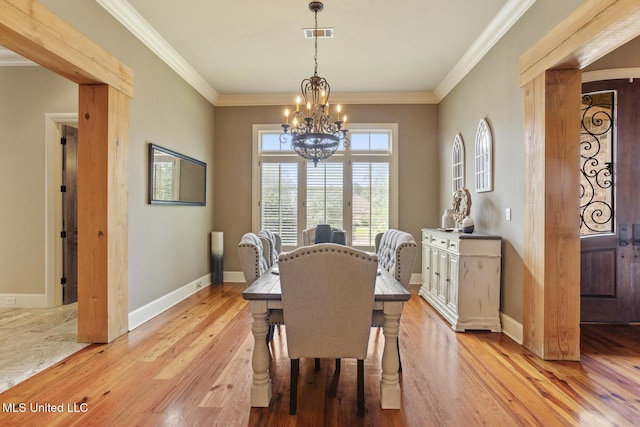 430 Johnstone Dr, Madison, MS 39110 - dining room with a chandelier, light wood-style floors, ornamental molding, and baseboards
