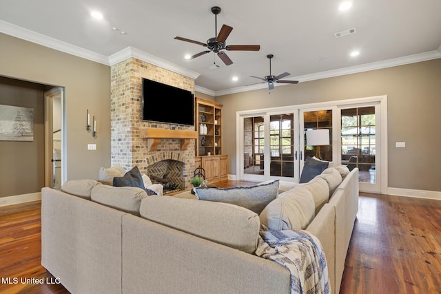 430 Johnstone Dr, Madison, MS 39110 - living area featuring ceiling fan, a brick fireplace, wood finished floors, crown molding, and baseboards