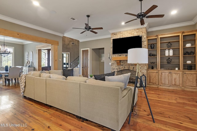 430 Johnstone Dr, Madison, MS 39110 - living area with ceiling fan, light wood-type flooring, crown molding, a brick fireplace, and recessed lighting