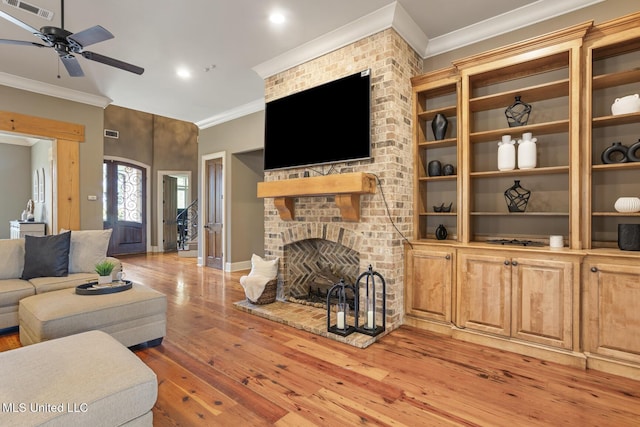 430 Johnstone Dr, Madison, MS 39110 - living area with ceiling fan, crown molding, light wood-style floors, a brick fireplace, and recessed lighting
