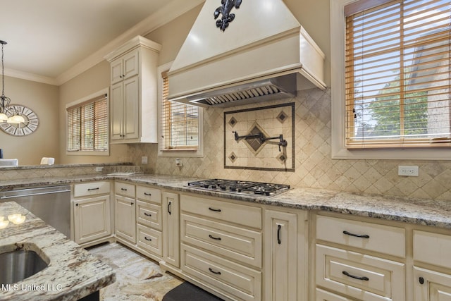 430 Johnstone Dr, Madison, MS 39110 - kitchen with custom exhaust hood, stainless steel appliances, cream cabinets, backsplash, and light stone counters