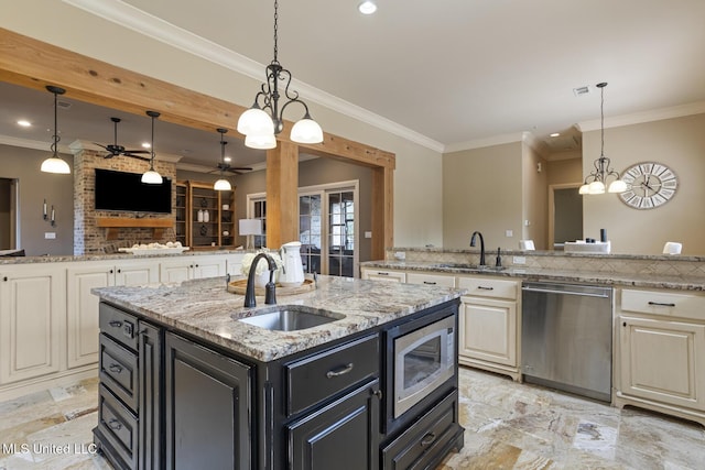 430 Johnstone Dr, Madison, MS 39110 - kitchen featuring appliances with stainless steel finishes, a sink, a ceiling fan, dark cabinetry, and crown molding