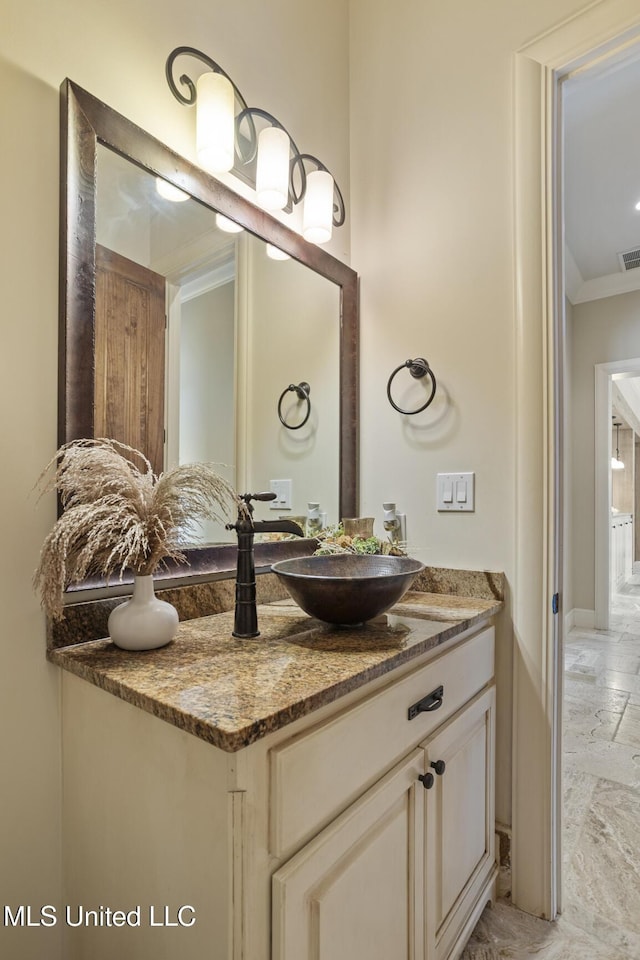430 Johnstone Dr, Madison, MS 39110 - bathroom featuring ornamental molding, vanity, stone tile floors, and baseboards