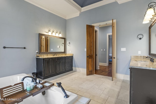 430 Johnstone Dr, Madison, MS 39110 - bathroom with ornamental molding, two vanities, a bath, and baseboards